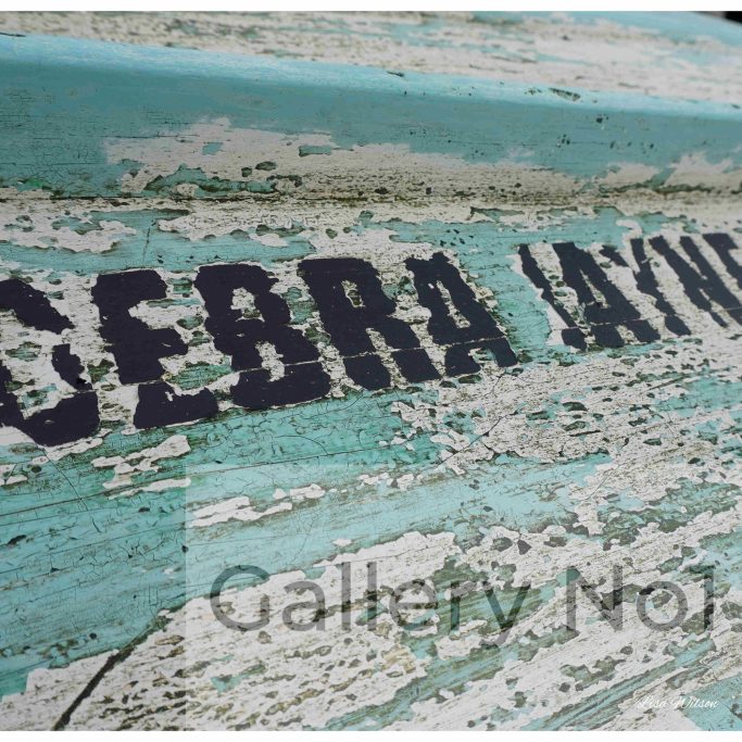 Find photograph of distressed boat by Lisa Wilson for sale
