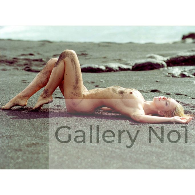 Find a photograph of Ali Clemance naked on a sandy beach