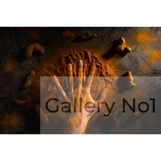 Find a photograph with a hand amongst turmeric by Victor Anton