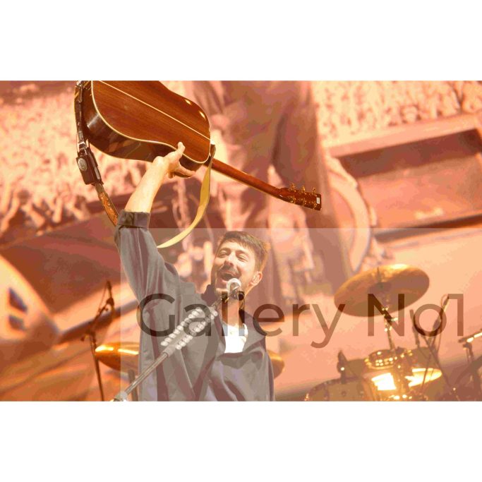 Look for photograph of Mumford and Sons performing on stage for sale