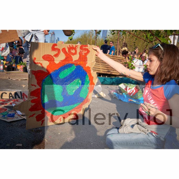 Find a photograph of a child climate activist (Rebellion protest march, London)