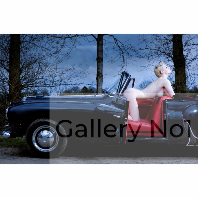 Look for photograph of naked woman in a classic car