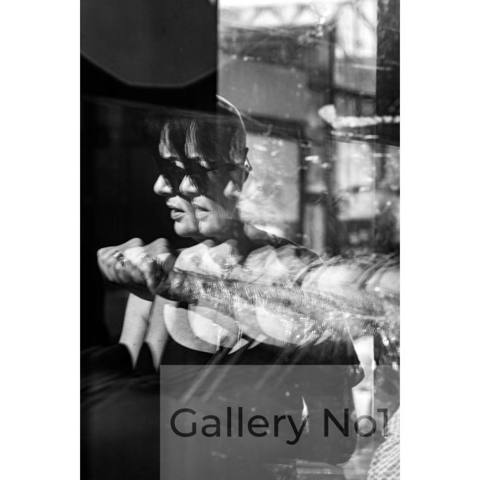 Search galleryno1.com for street photography with reflections