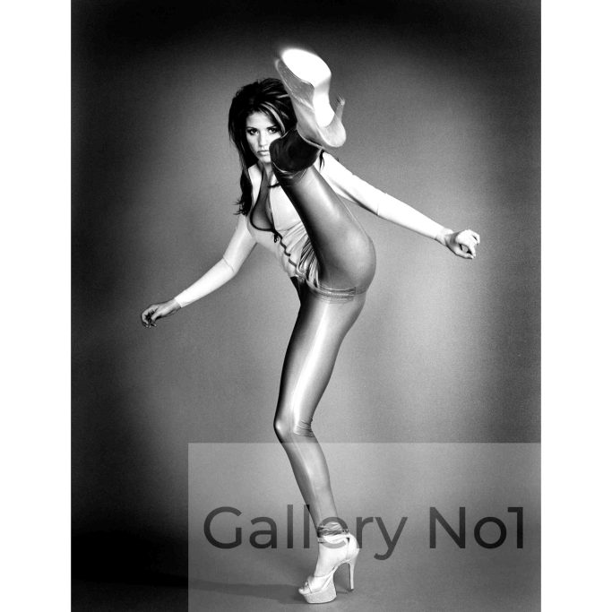 Find an unusual photograph of Katie Price doing a high kick